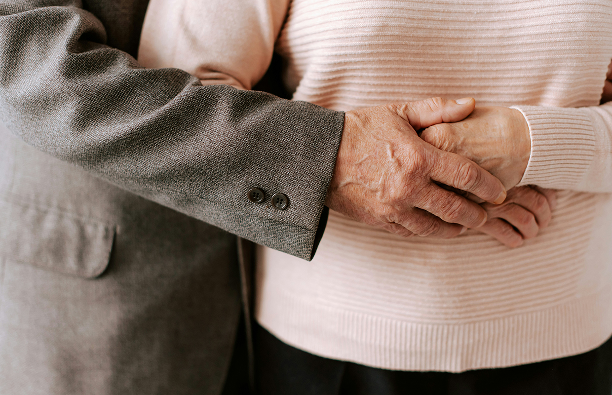 Old couple hugging