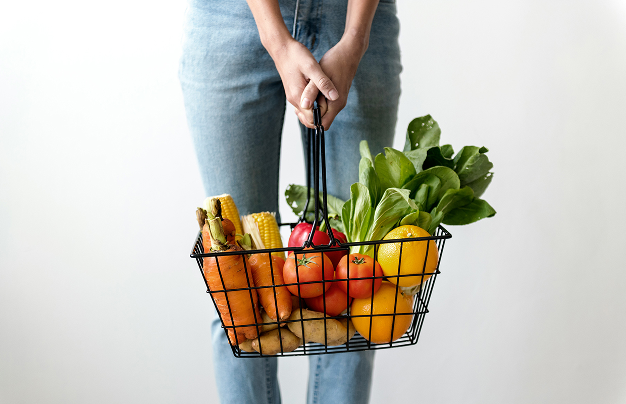 A shopping basket with vegetables