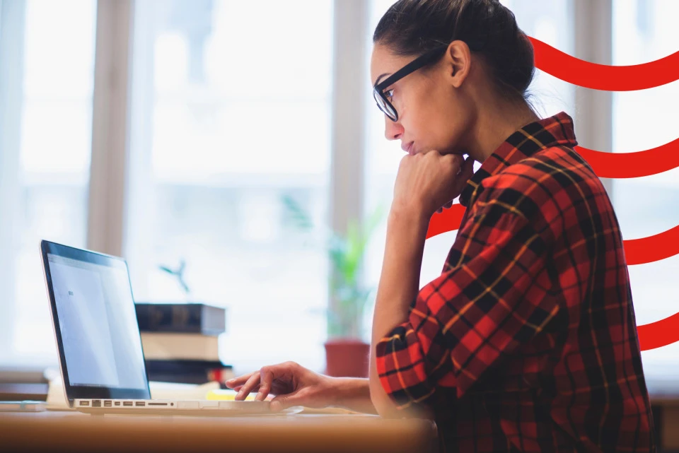 Woman typing on a laptop