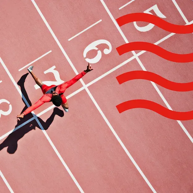 A runner crossing the finish line on a track