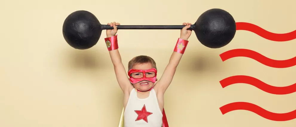 little boy holding weights