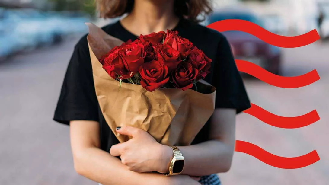 A girl holding red roses