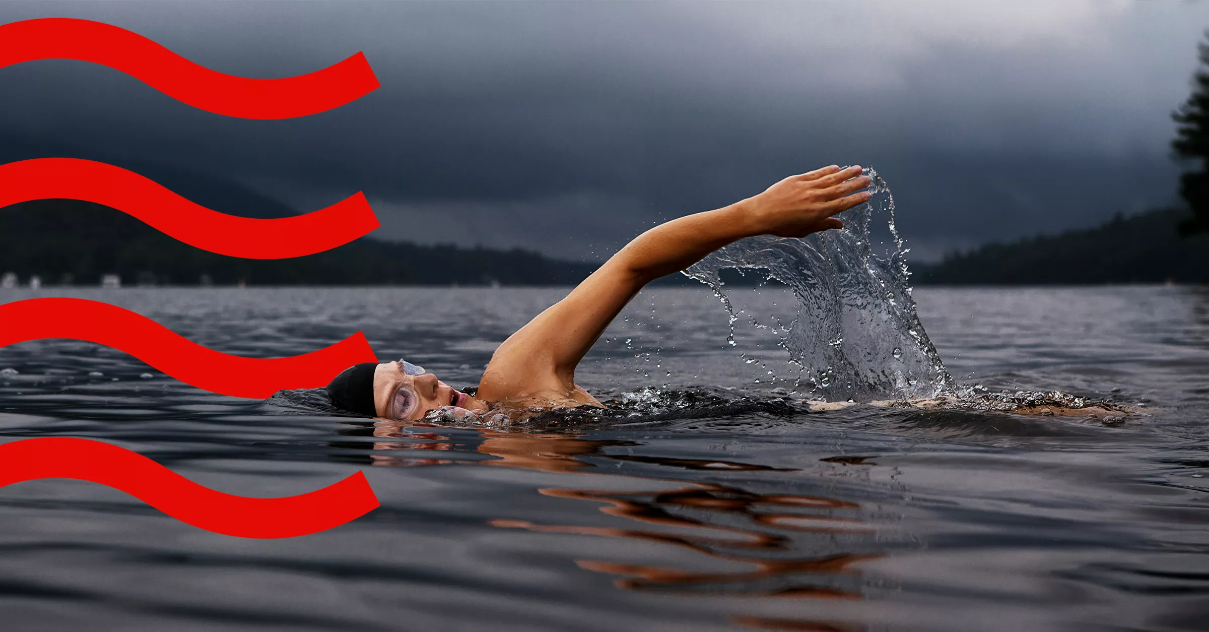 A man swimming in a lake