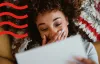 A woman reading a letter