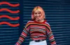 A girl with a colorful jumper 