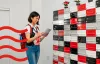 A woman opening an envelop
