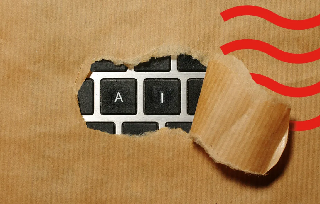 A torn piece of brown paper revealing a keyboard with the letters A and I