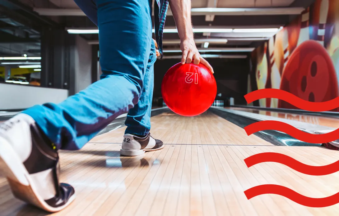 A man playing bowling