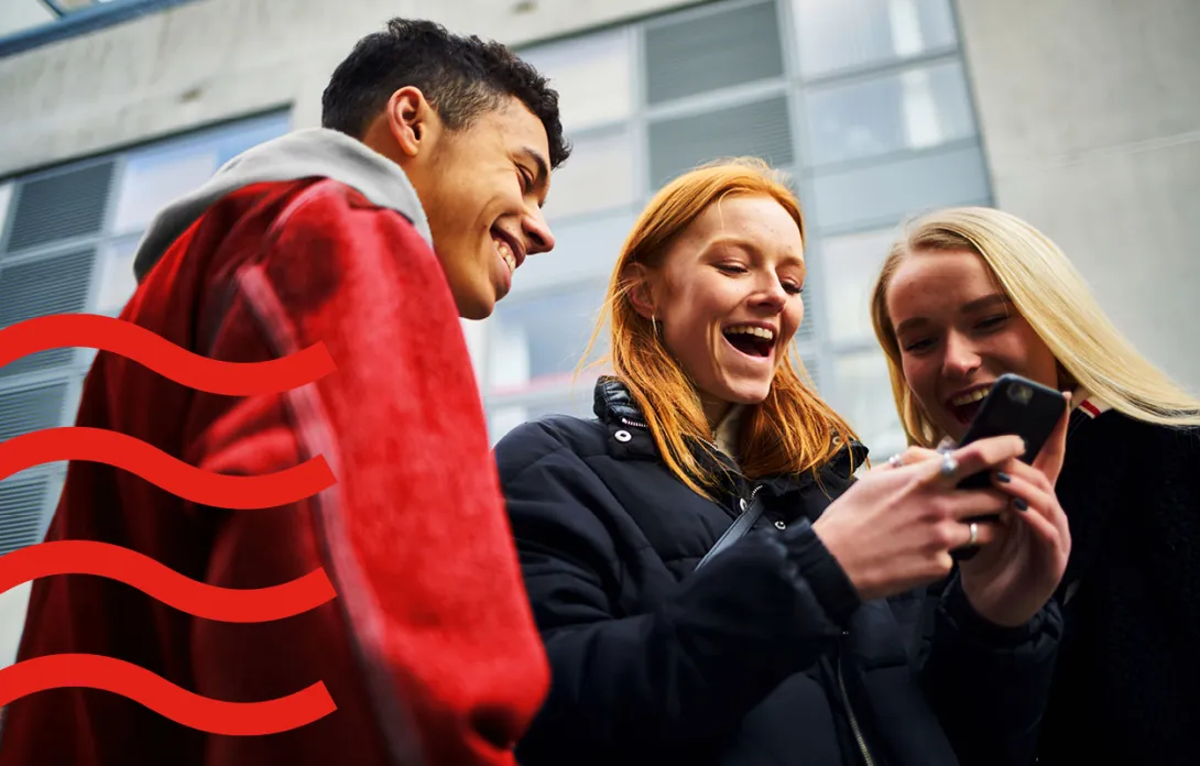 friends looking at phone